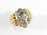 an image of a gold and diamond ring on a white background