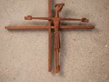a cross made out of wood on the ground