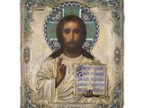 une icône ancienne représentant Jésus tenant une croix et une plaque