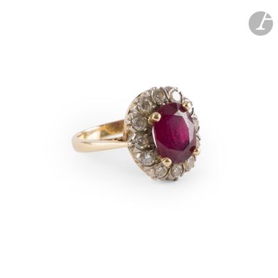 an oval ruby and diamond ring