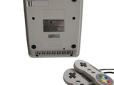 a nintendo game controller next to a nintendo game console