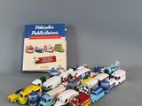 a lot of toy trucks that are sitting on a table