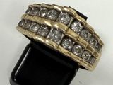 an image of a gold ring with diamonds on it