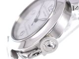 a close up of a watch on a white surface
