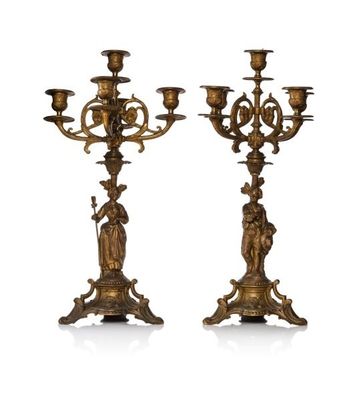 pair of antique brass candelabs with figures on each of them