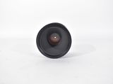 a close up of a camera lens on a white surface