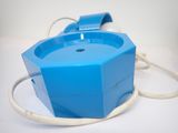 a blue box with a white cord attached to it