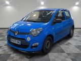 the small blue car is parked in the garage on a checkered floor