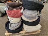 a pile of tires stacked on top of each other on a pallet