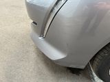 a close up of a car that has a denting on it