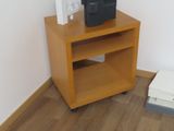 a small wooden table with a printer on top of it