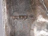 a close up of a silver plate with a name on it