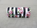 black and white striped wallet with pink roses on it