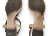 pair of women ' s sandals on a white surface with a white background