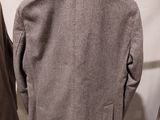 an image of a jacket on a mannequin stand