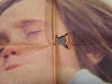 a picture of a woman with a butterfly on her face