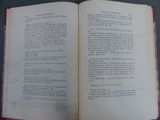 an open book on a table with writing on it