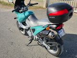 a motorcycle that is parked on the side of the road