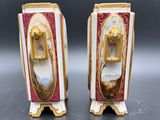 pair of antique porcelain figurines of a woman and a man