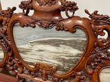 a wooden frame with a picture on it on a table