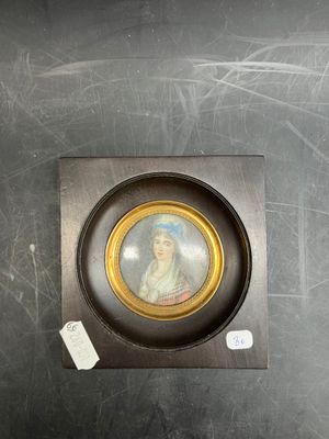 a picture of a woman in a picture frame on the wall