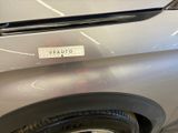 a close up of a car with a sticker on it ' s bumper