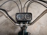 a close up view of a motorcycle handlebars and gauges