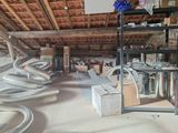 a room that has a bunch of pipes and boxes on the floor