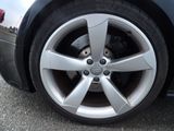 a close up of a tire on a car ' s rim