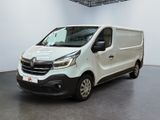the white van is parked in a large room with a black floor