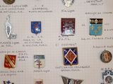 many different types of badges displayed on a piece of paper