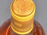 a close up of a bottle of alcohol on a table
