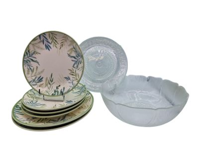 a stack of plates and bowls sitting on top of each other