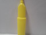 a yellow bottle that is sitting on a white surface
