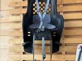 an image of a child ' s car seat hanging on a wall