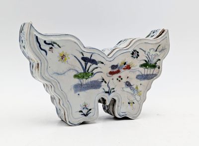a white butterfly shaped object on a white surface