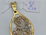 a gold and diamond pendant on a white background