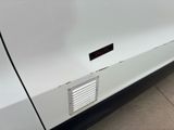 a close up of a car door with a sticker on it