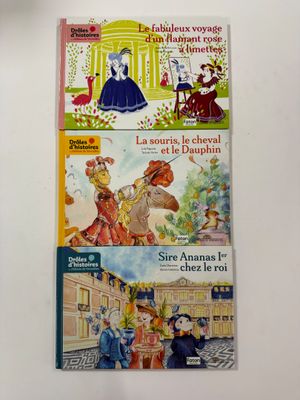 three children ' s books that are on the wall