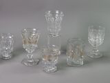 a lot of wine glasses that are sitting on a table