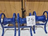 three blue hoses sitting on a table with a price tag on it