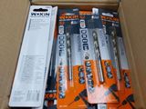 several batteries are in a cardboard box on a table