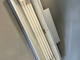 a white radiator on the wall next to a window