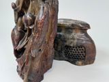 a statue of a woman sitting on a bench