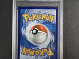 a close up of a pokemon card on a table