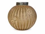 a brown vase with designs on it on a white surface