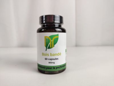 un flacon de gélules « Dols Banute » posé sur une surface blanche