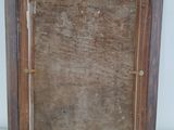 an old picture frame with a wooden frame on a white surface