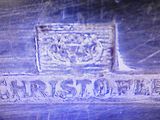 a close up of a street sign on a wall