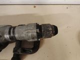 an image of a drill and a hammer on a counter